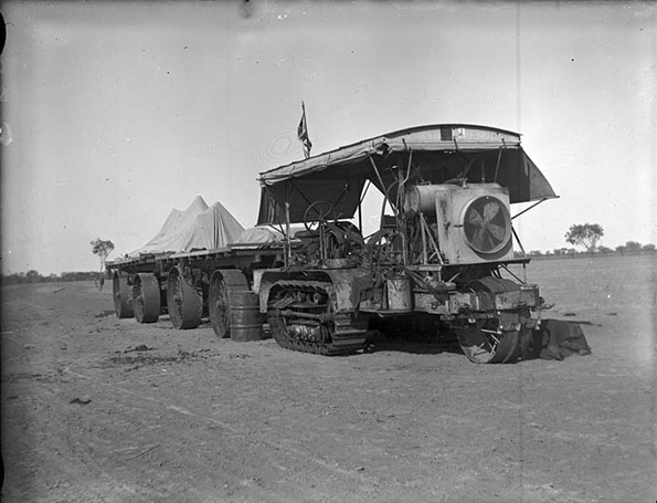 Caterpillar tractor hauling trailers, 1914-17