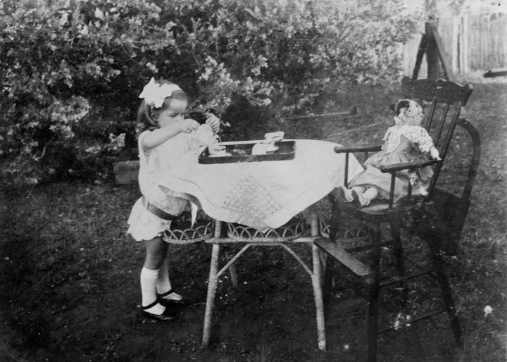 Young girl’s garden tea party, 1915